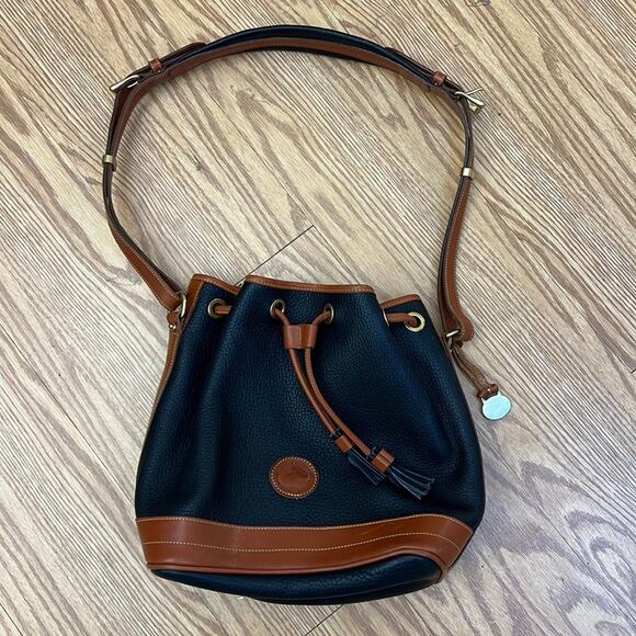 Dooney & Bourke tassel bucket bag blue pebbled leather tan accent gold hardware